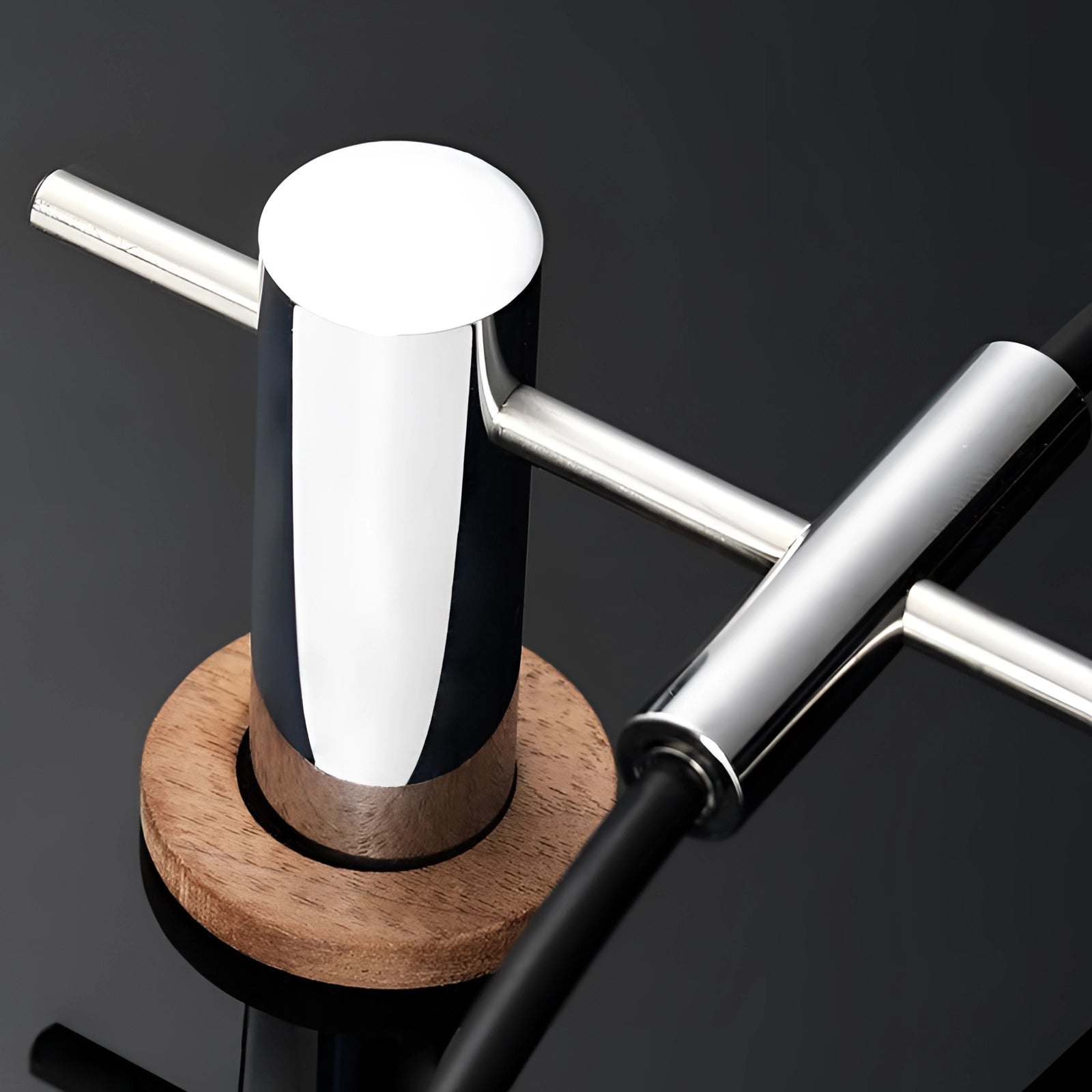 Large luxury metal wall clock with a modern minimalist design, featuring a sleek metallic finish and simple, elegant lines, set against a stylish background.