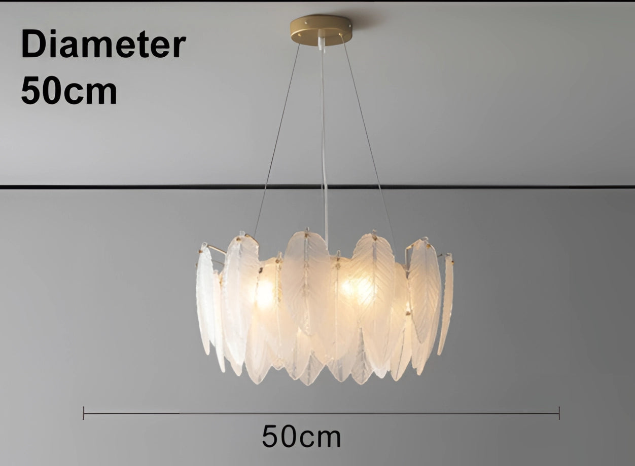Modern elegant leaf-shaped gold chandelier, 50 cm, hanging from the ceiling, illuminating a luxury bedroom.