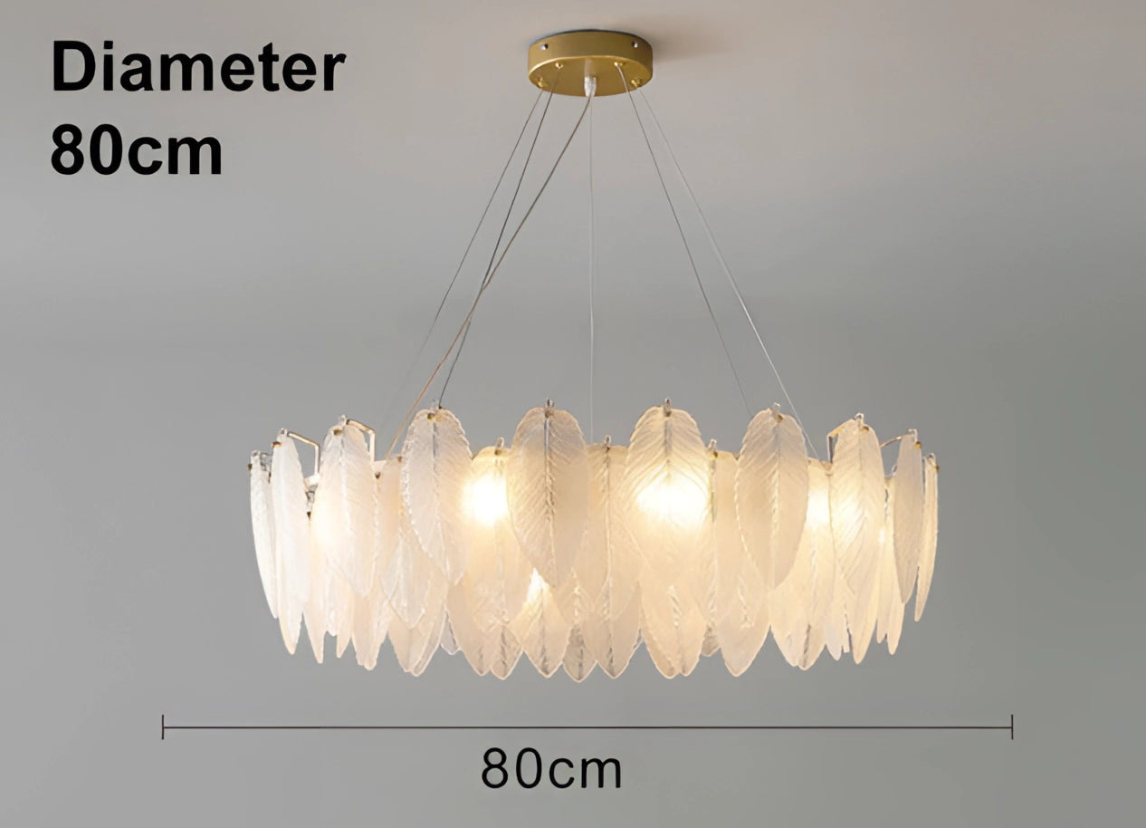 Elegant leaf-shaped gold chandelier with modern design, 80 cm, hanging from the ceiling, illuminating a luxury bedroom.