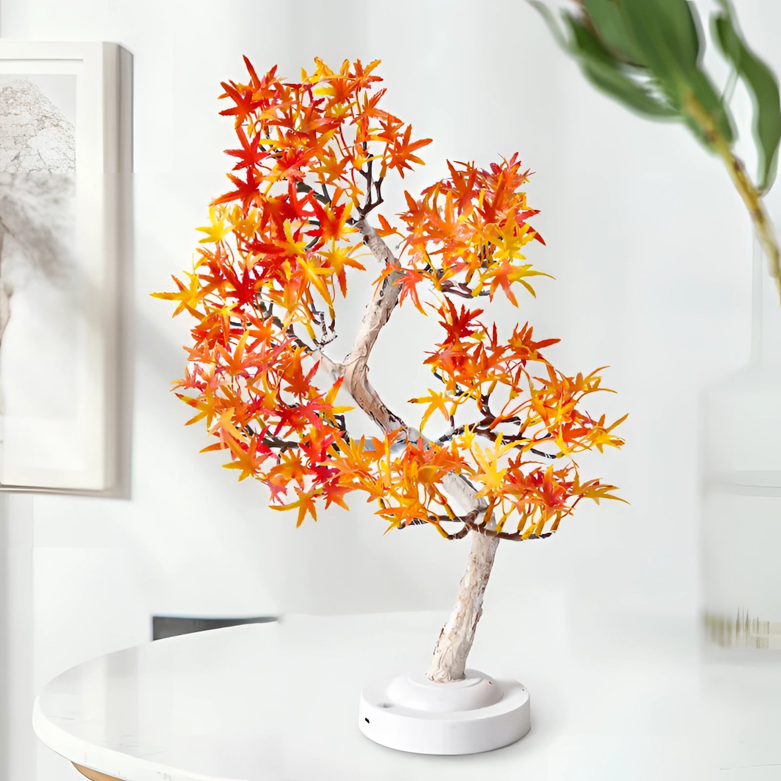 LED bonsai tree lamp with maple leaves in shades of amber and orange, resembling autumn foliage, set in a small pot, perfect for indoor decoration.