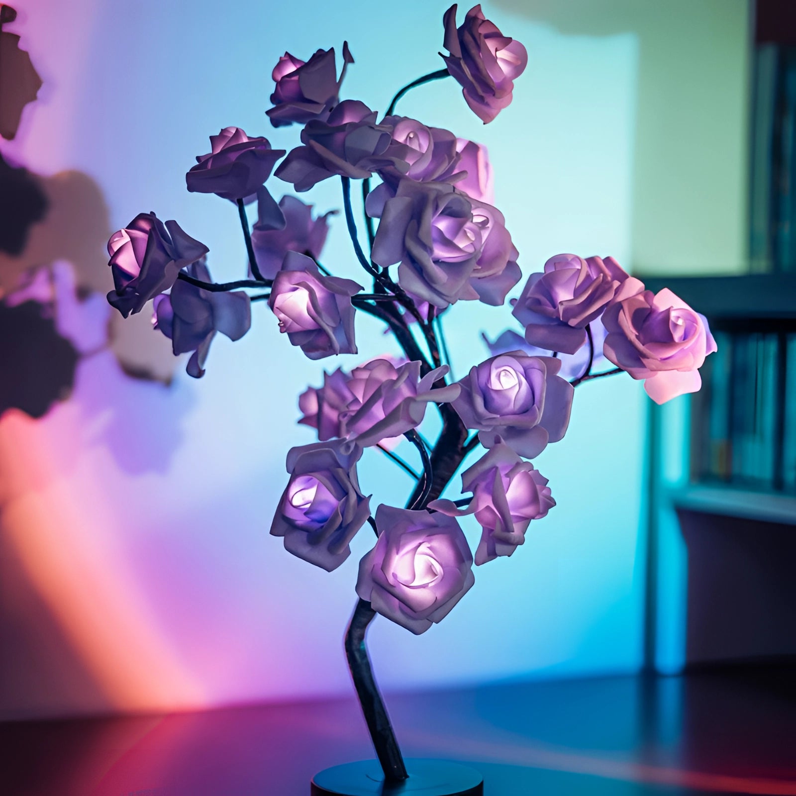 Purple LED rose lamp featuring a realistic, artificial flower with vibrant petals in shades of purple, blue, and violet, designed as a decorative light-up piece for romantic settings or as a Valentine's gift.