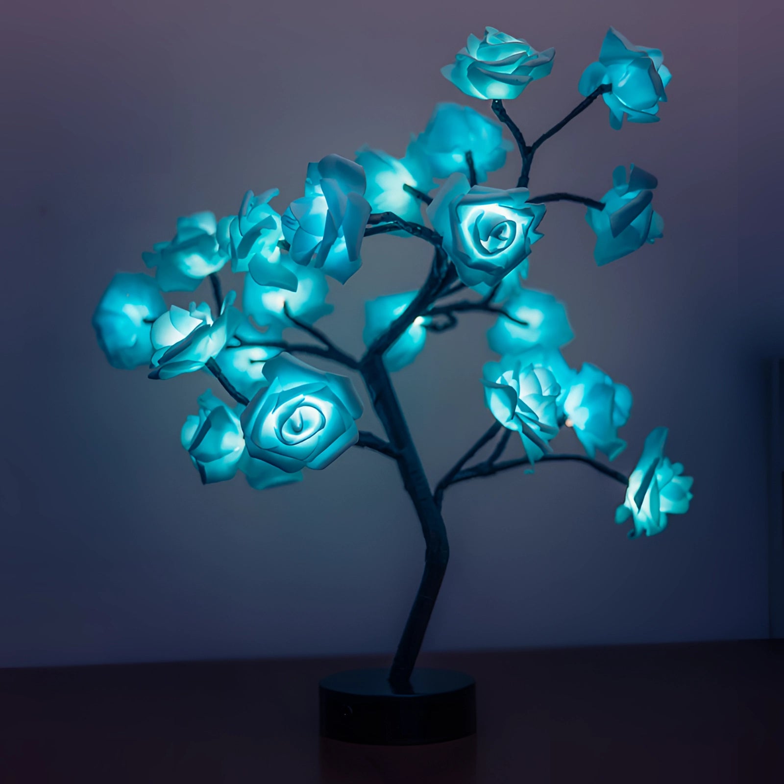 Blue LED rose lamp with illuminated petals and twigs, designed as a romantic flower decor piece. Ideal as a Valentine's gift.