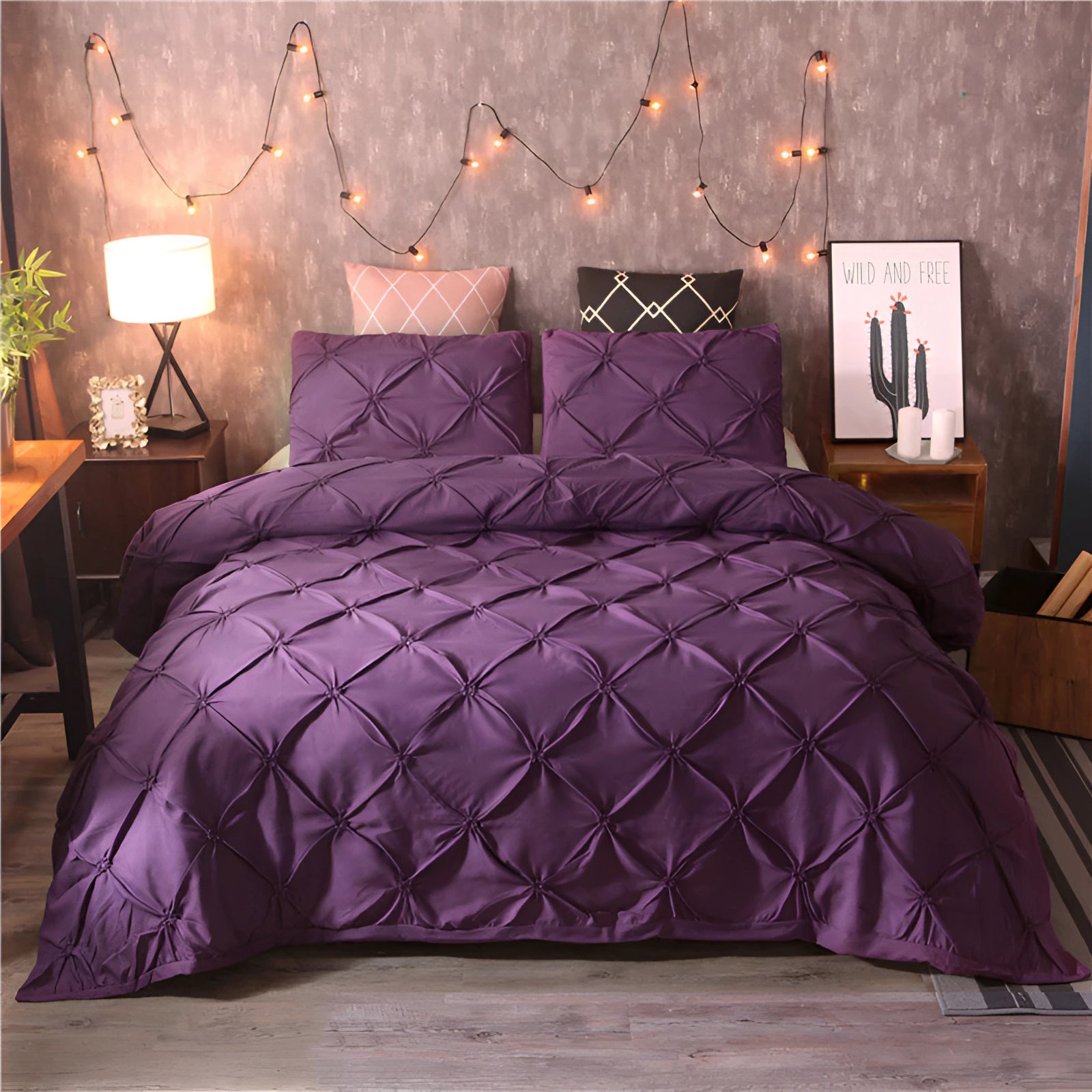 Luxury black pinch pleat comforter set in a rich purple color, displayed on a bed within a stylishly decorated bedroom, featuring modern geometric designs. The set enhances the interior decor, paired with complementary furniture and accessories, including a wooden bed frame and ambient lighting.