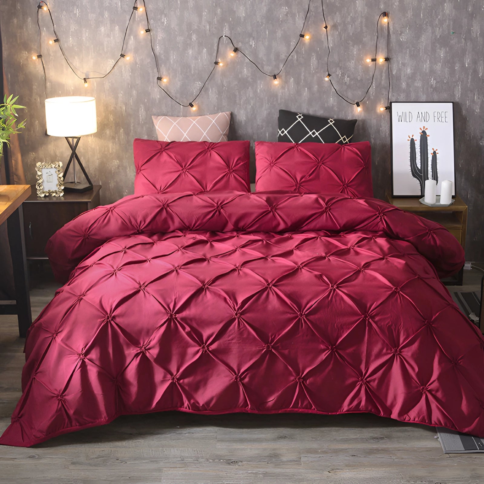 Luxury black pinch pleat comforter set with a geometric modern decor in a red variant, displayed in a stylish bedroom setting with complementary interior design elements including textiles and decorative accents.