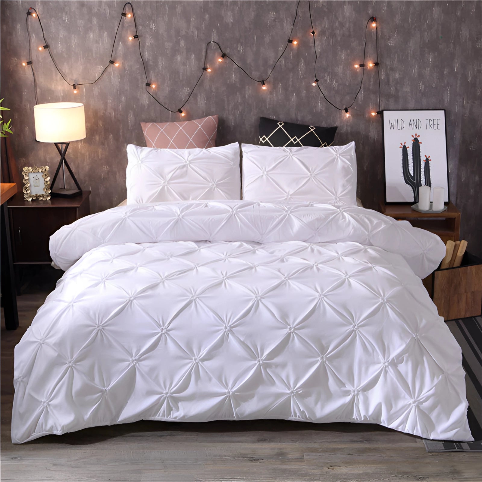 Luxury black pinch pleat comforter set with geometric modern decor in white, displayed on a rectangular bed frame with matching pillows, set in a stylishly designed bedroom featuring wooden elements and a modern lamp.