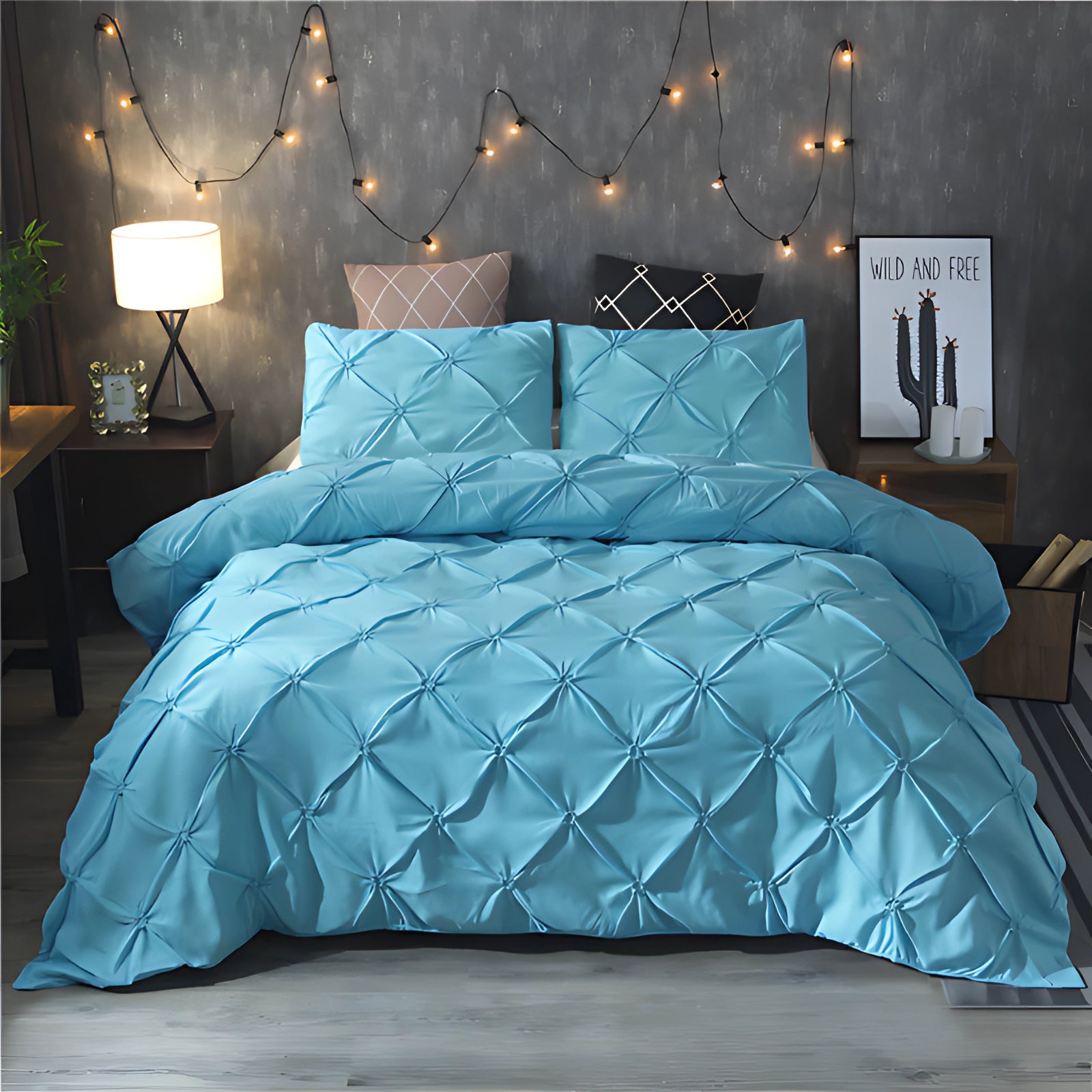 Luxurious black and blue pinch pleat comforter set with a geometric modern design, displayed on a neatly made bed with a sturdy bed frame, complemented by warm lighting from a nearby lamp, creating a cozy and stylish bedroom ambiance.