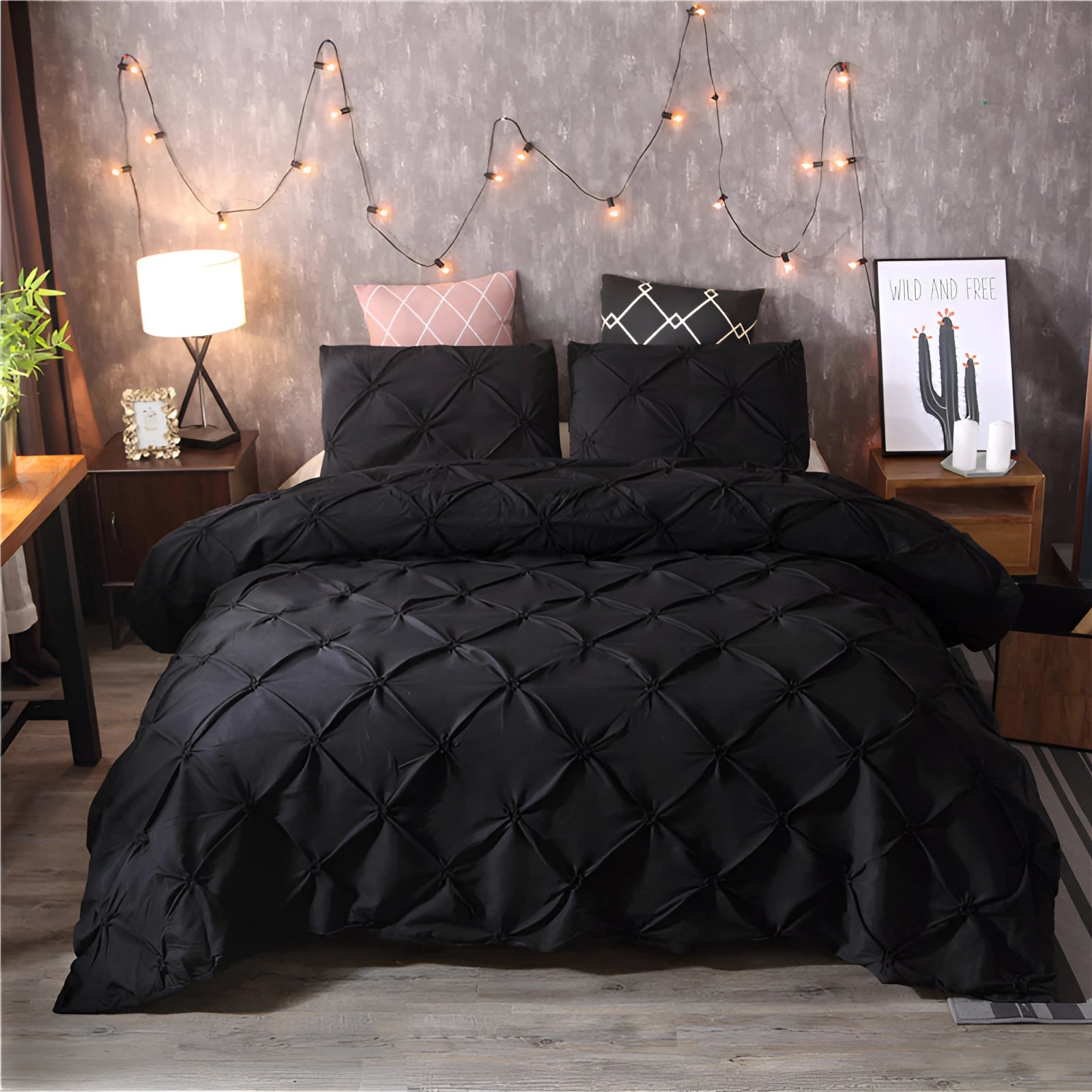 Black luxury pinch pleat comforter set with a geometric modern design on a large bed in a well-decorated bedroom, featuring wooden furniture and houseplants for a cozy and stylish interior.
