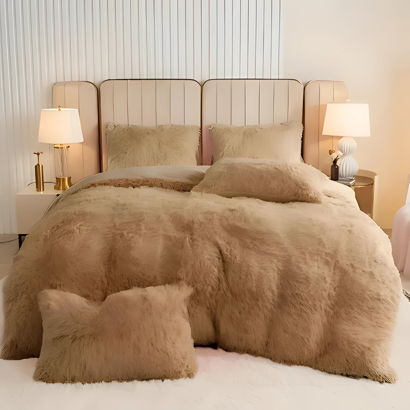 A luxurious blue faux fur comforter draped over a superking-sized bed with a Braun color, surrounded by a wooden bed frame, lamp, and grey and beige decor, placed on a hardwood floor.