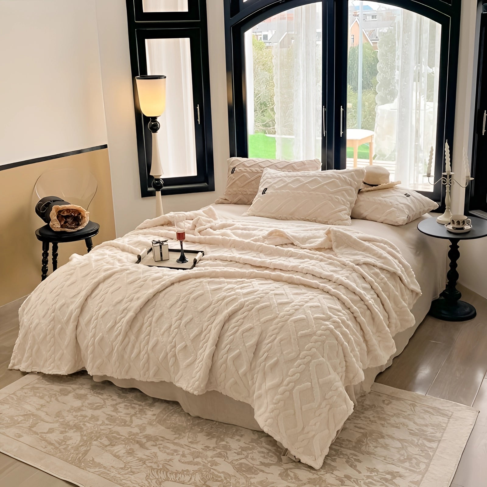 Luxury cream textured duvet cover on a neatly made bed with a wooden bed frame, complemented by matching pillows, showcasing an elegant high-end bedding setup in a stylishly designed interior.