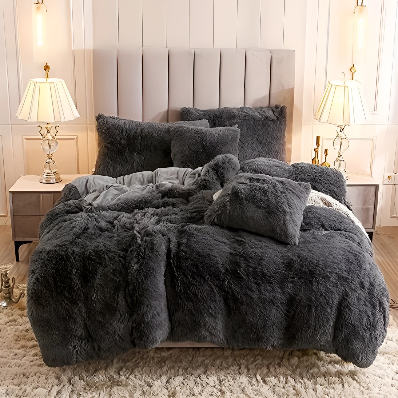 Luxury dark grey faux fur bedding set displayed in a cozy bedroom setting, featuring a plush comforter and matching shams on a superking-sized bed. The room is elegantly designed with hardwood flooring and ambient lighting, creating a warm and inviting atmosphere.