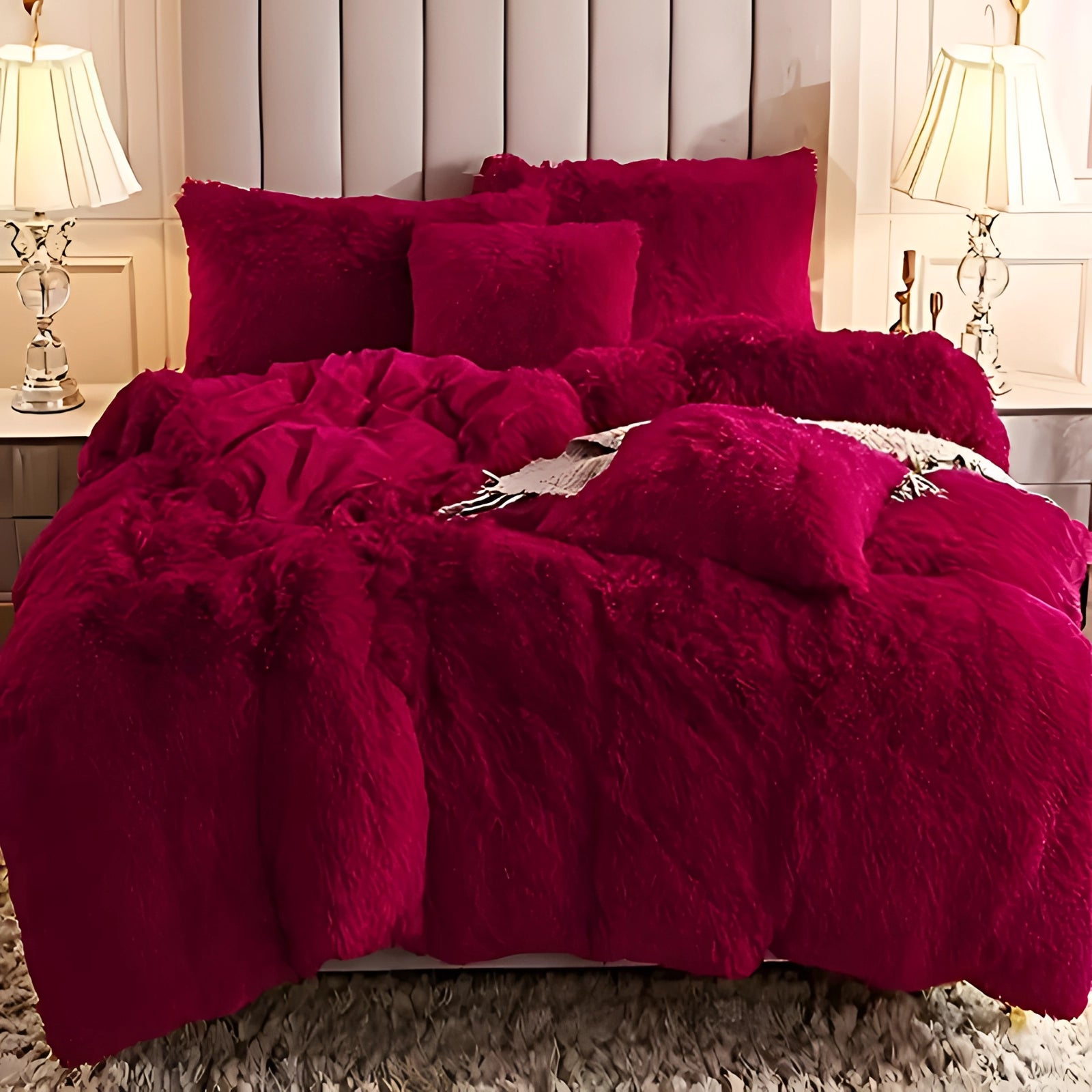 A luxurious dark grey faux fur bedding set featuring a plush comforter and matching shams displayed on a super king-sized bed. The room is elegantly styled with soft lighting, accentuating the comfort and warmth of the bedding.