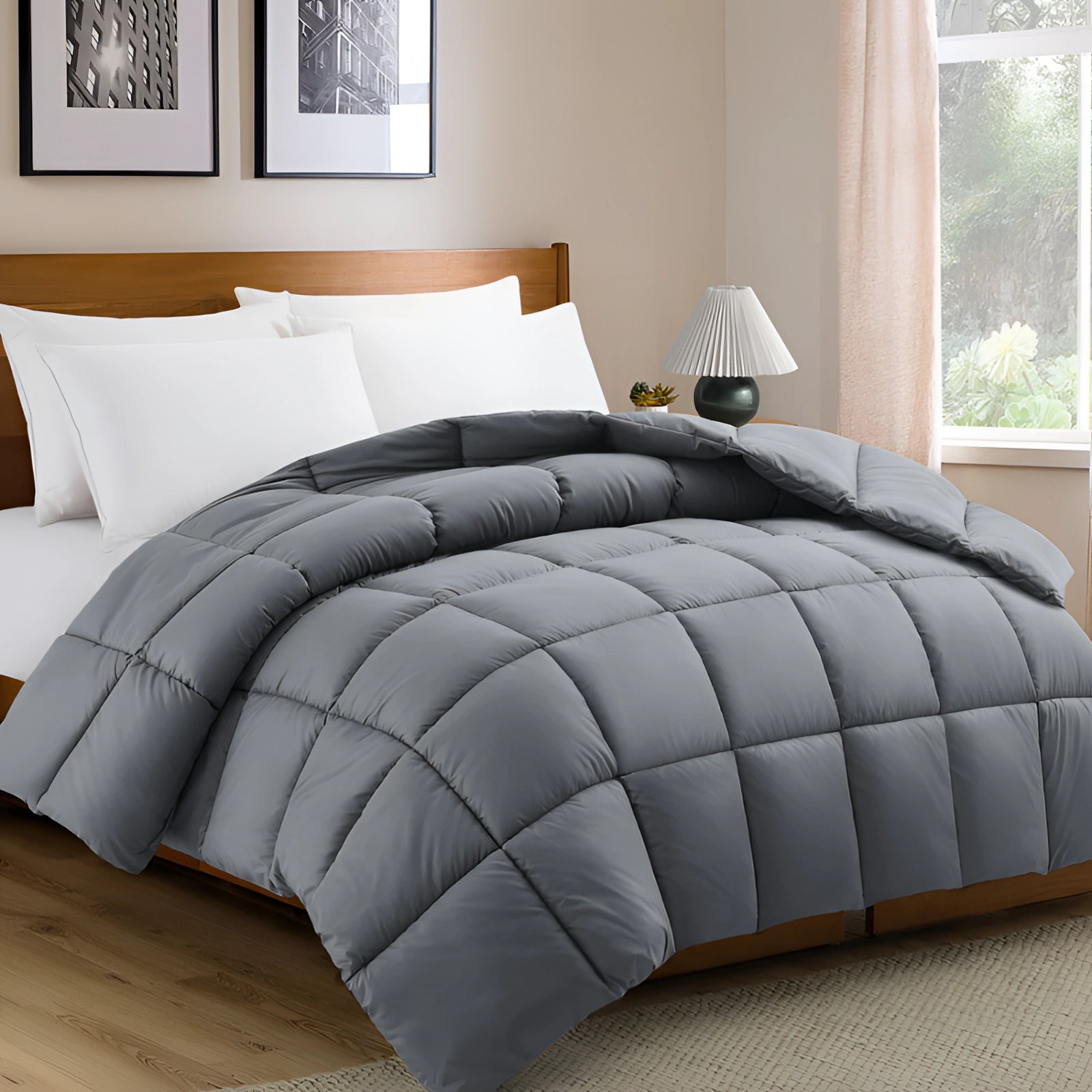 Luxury dark grey hypoallergenic down alternative comforter spread across a bed, with a soft texture and light appearance, displayed in a modern setting with light flooring and minimal decor. The comforter in the image is gray and measures 229 x 269 cm.