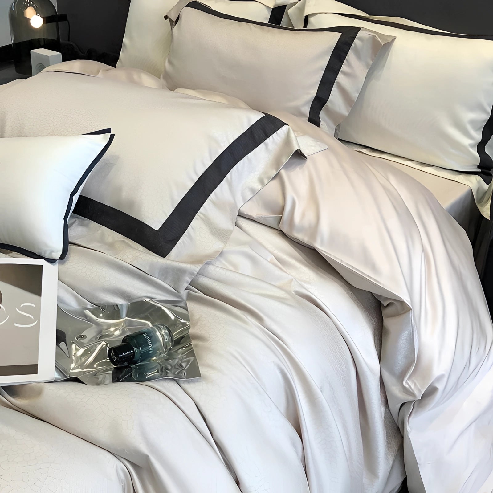 Luxury Egyptian Cotton Bedding Set in champagne color with elegant black trim, displayed on a king-sized bed. The set includes plush pillows and soft linens, adding a touch of contemporary style and comfort to the bedroom interior.