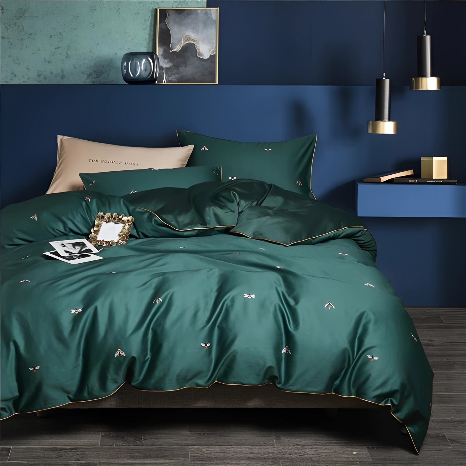 Luxury green silk bedding set featuring a bee pattern, complete with embroidered pillowcases, elegantly displayed on a California King bed.