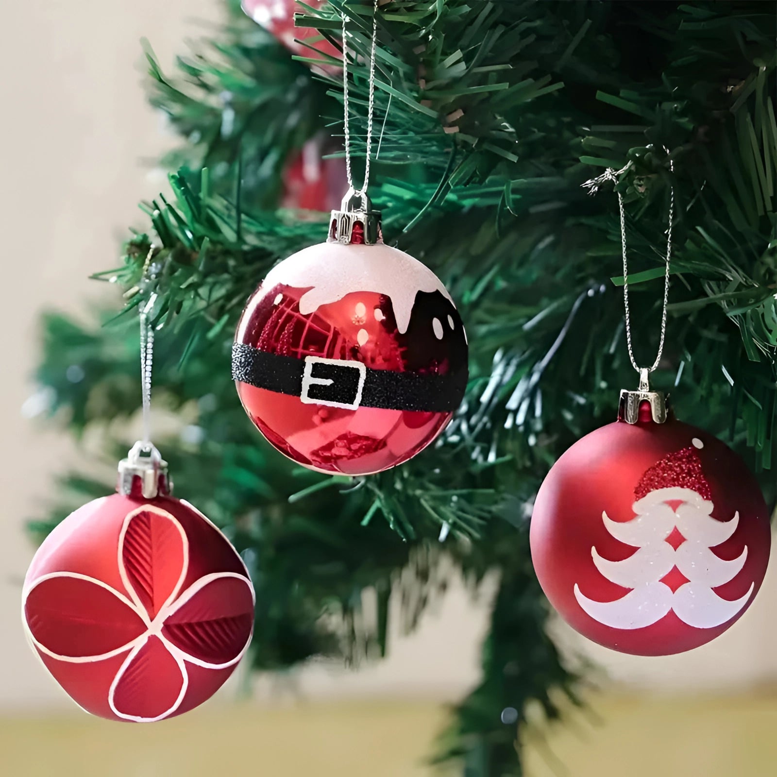 Luxurious red, green, and gold Christmas ornaments adorning an evergreen Christmas tree, illuminated by soft lights, creating a festive holiday ambiance.