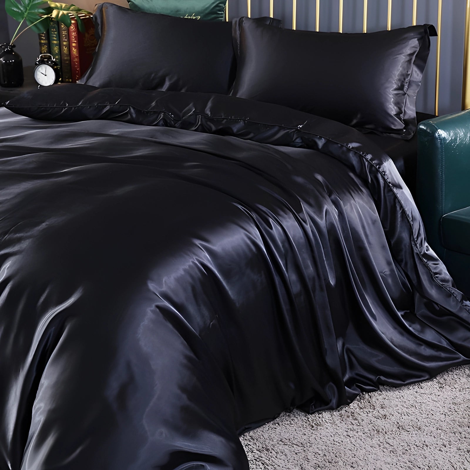 Luxurious black silk bedding set in a 4-piece configuration, featuring a fitted sheet, designed to be hypoallergenic and thermal regulating, suitable for a 180x200cm bed.