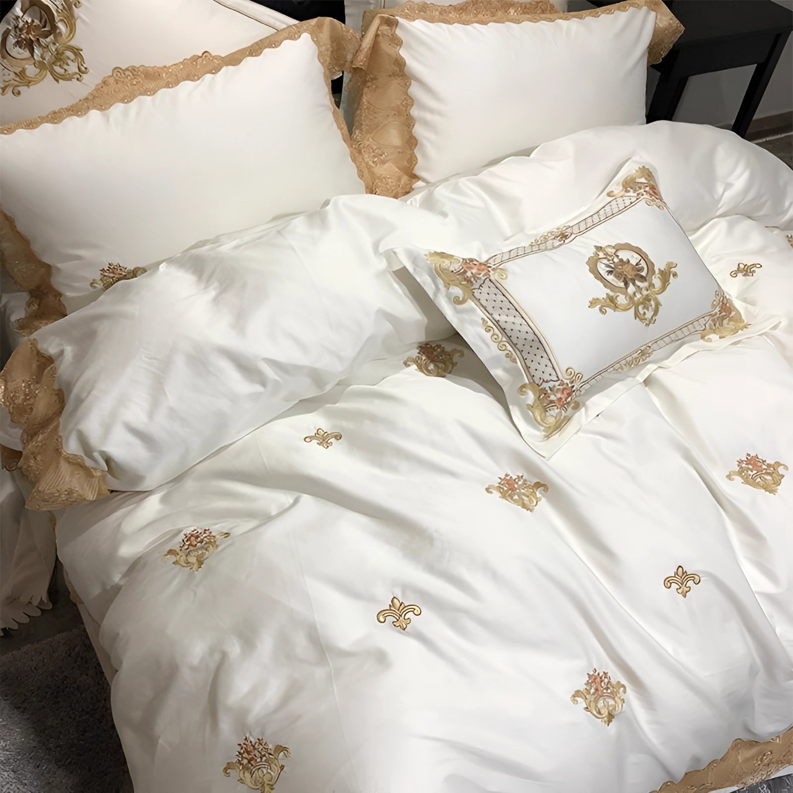 Luxury silk bedding set featuring a gold embroidered duvet and pillowcases, displayed on a neatly made bed, showcasing a sense of comfort and elegance.