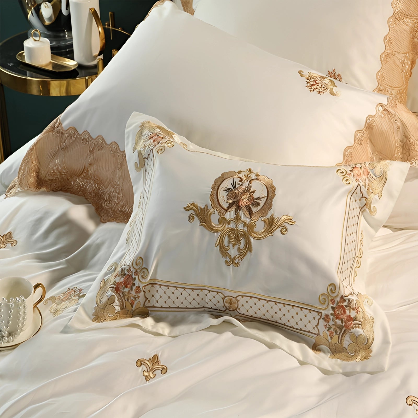 Luxurious silk bedding set featuring a gold embroidered duvet and matching pillowcases, displayed in a beige color scheme with decorative patterns for added elegance and comfort.