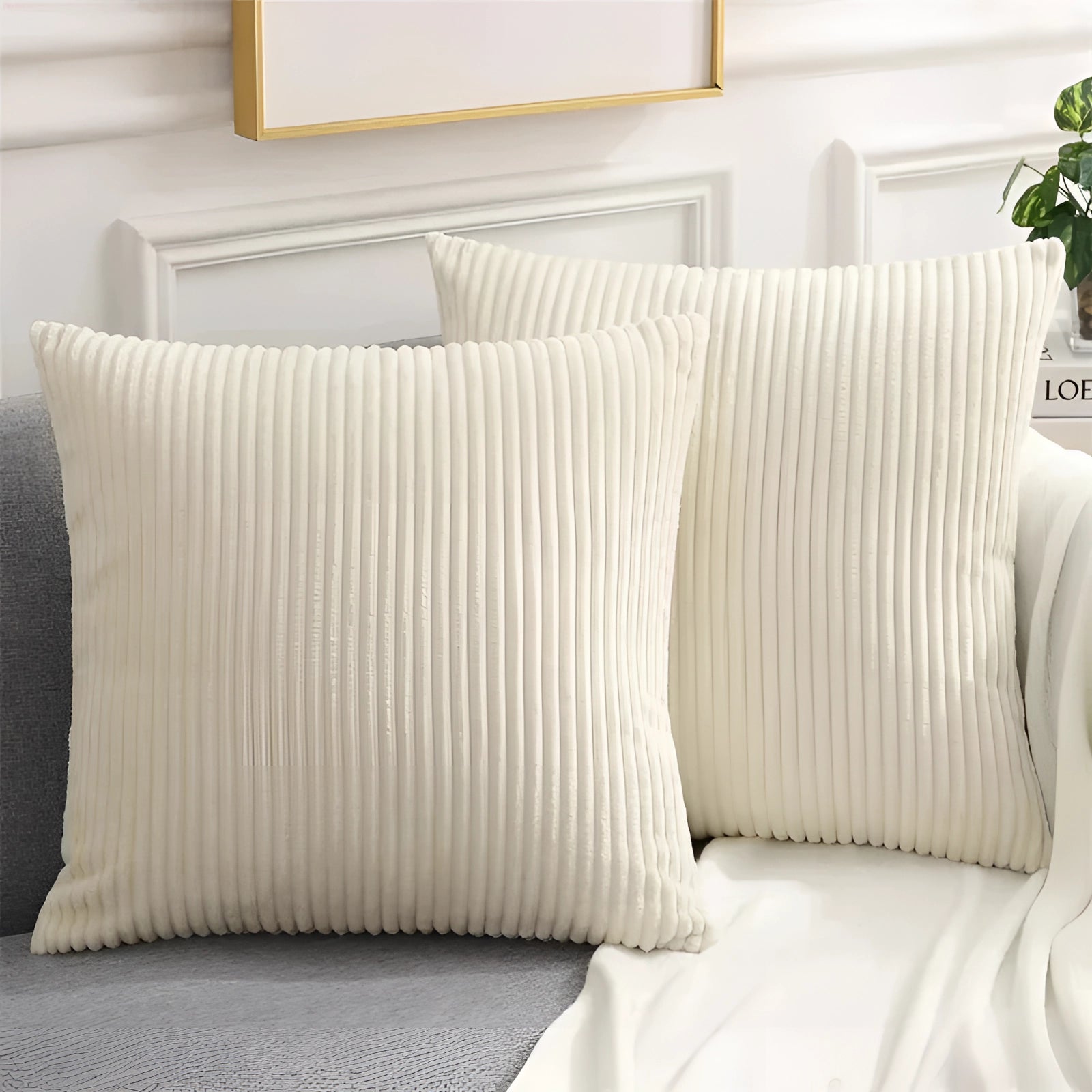 Luxury soft corduroy cushion cover in cream, measuring 50x50cm, displayed on a grey couch with wooden accents, showcasing high-quality upholstery fabric.