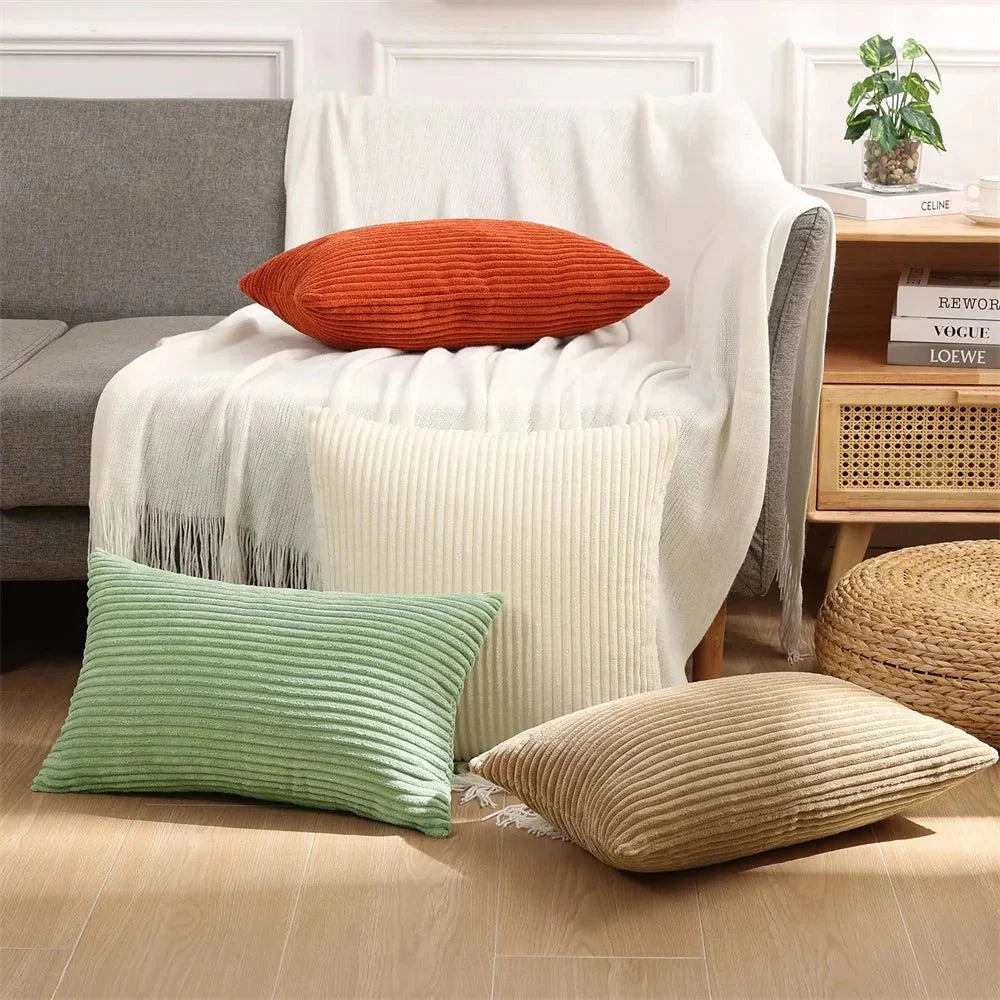 Luxury soft corduroy cushion cover displayed on a wooden chair, showcasing its high-quality upholstery fabric with a rectangular shape, emphasizing comfort and style in an interior design setting.