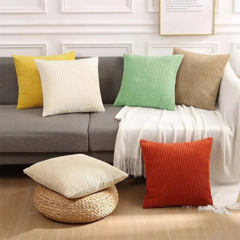 Luxury soft corduroy cushion cover in a light shade, displayed on a white couch in a stylish interior setting, showcasing its high-quality upholstery fabric and rectangular shape designed for comfort and elegance.