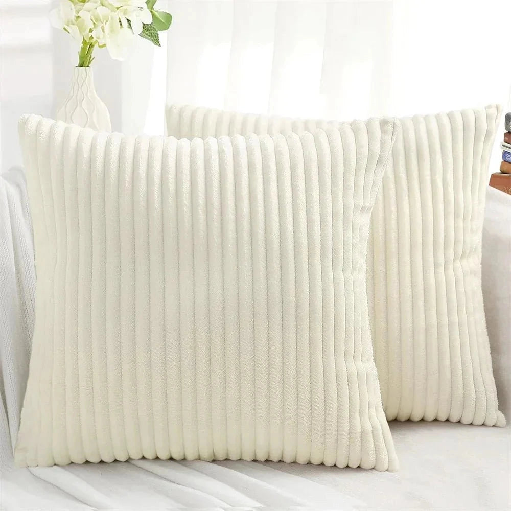White luxury soft corduroy cushion cover in 50x50cm size displayed on a beige couch with wooden accents, featuring high-quality upholstery fabric that adds comfort and style to home decor.