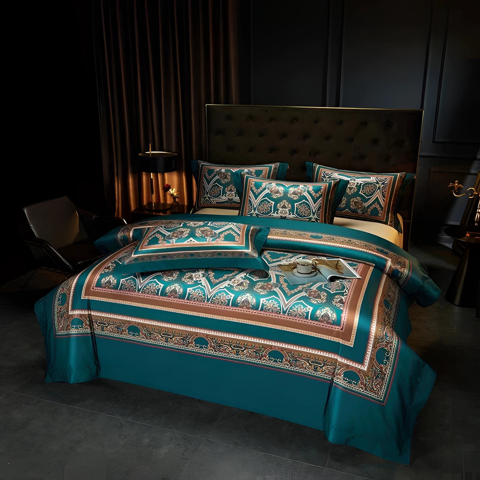 Luxurious teal paisley bedding set with elegant embroidery, featuring a dark blue duvet cover on a queen-sized bed, paired with plush pillows, set in a stylishly furnished bedroom.