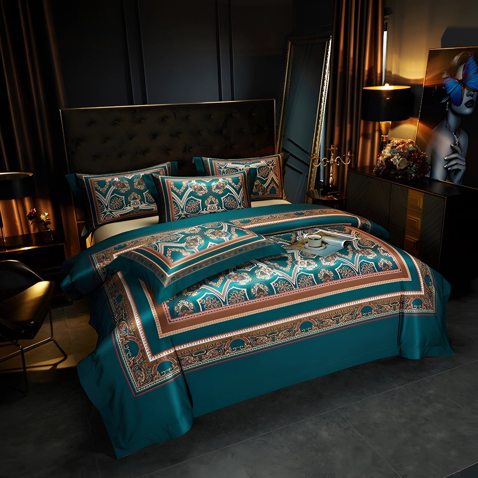 Elegant dark blue king-size bedding set with a luxurious teal paisley embroidery design displayed on a neatly made bed. The set includes matching pillows, creating a cohesive and comfortable appearance. The bed is framed by a wooden bed frame, situated in a well-decorated bedroom featuring a stylish lamp and hardwood flooring, enhancing the room's sophisticated ambiance.