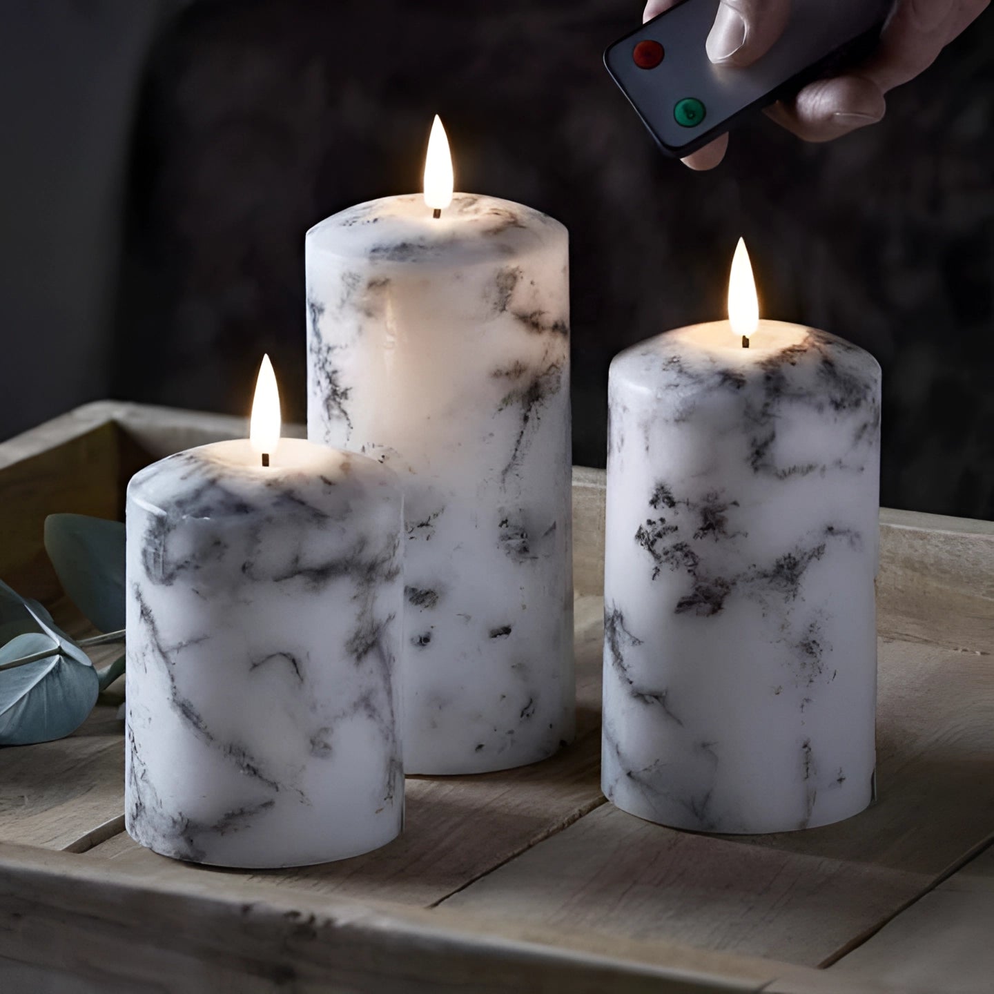 Marble design flameless LED candles with realistic flickering flame effect, remote-controlled, battery-operated, cylindrical wax exterior.
