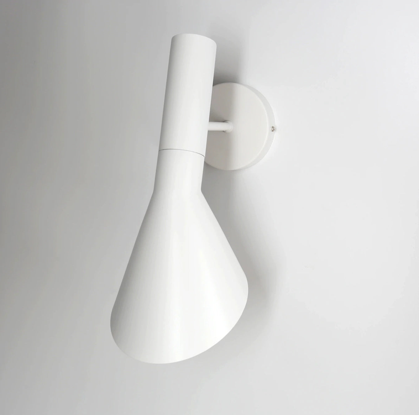 Matte black adjustable LED wall lamp with a modern sconce design, featuring a circular lampshade, ideal for bedroom lighting.