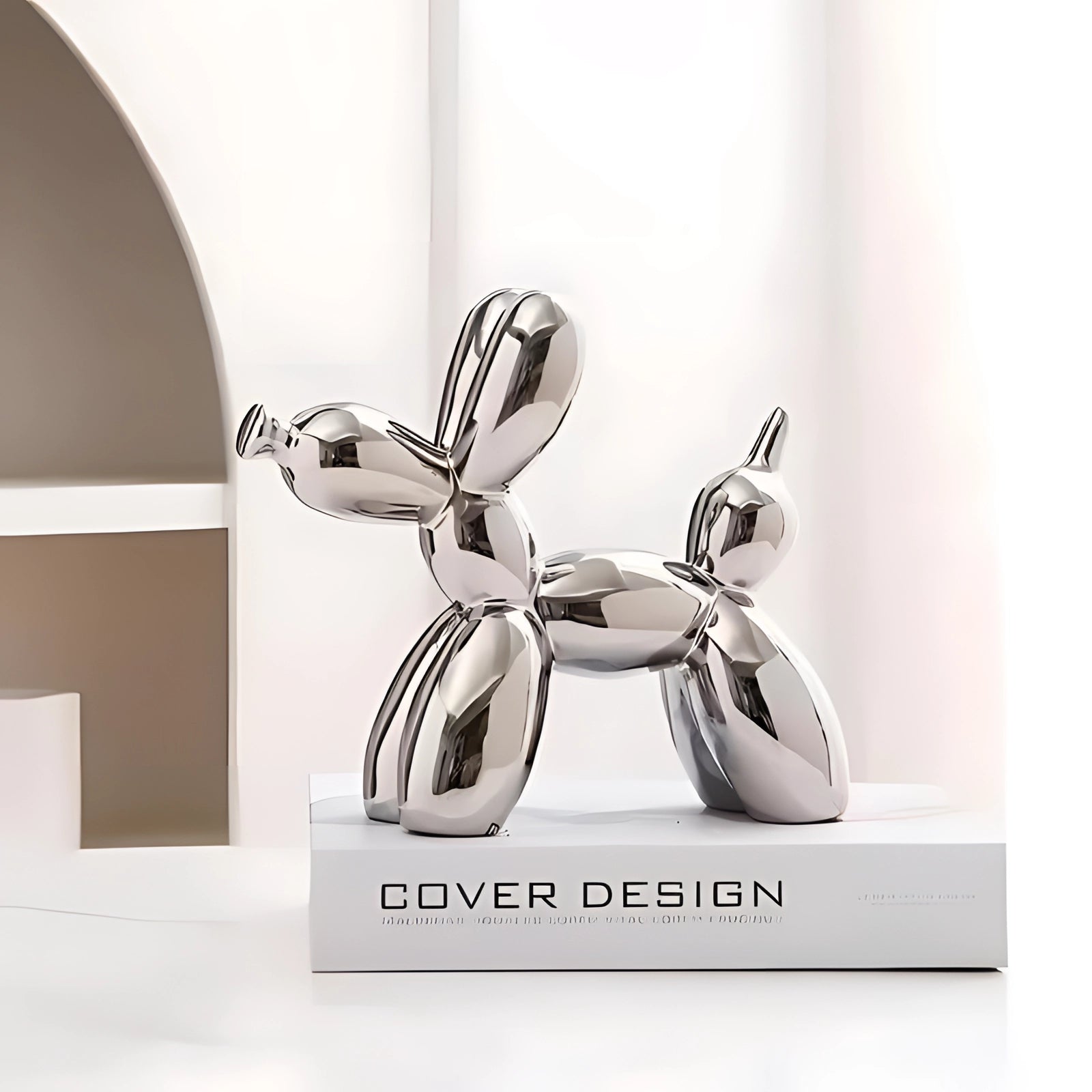 Silver metallic balloon dog sculpture resembling modern art decor, designed as a luxury accent piece.