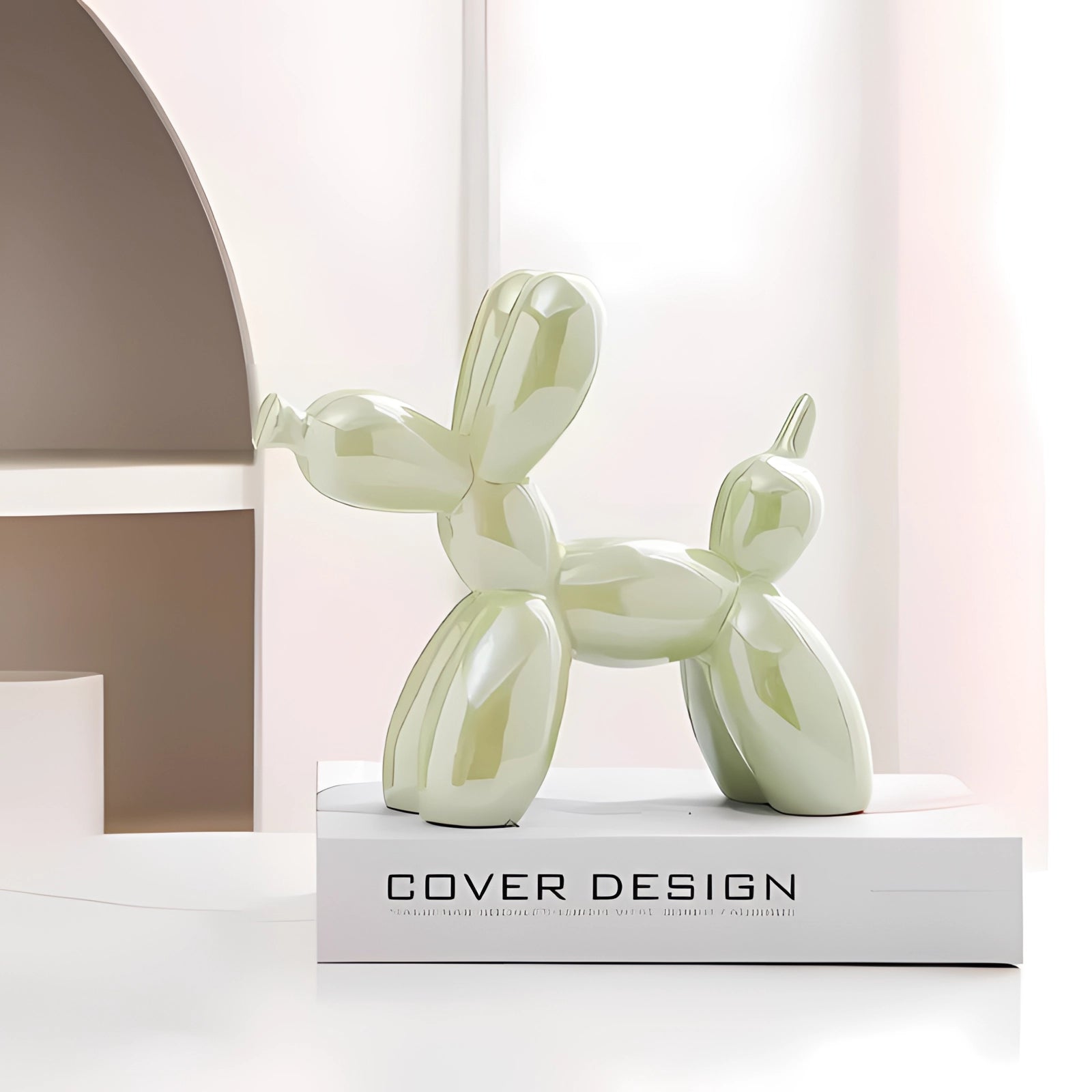 Metallic green balloon dog sculpture in a modern art decor style, displayed in a room setting.
