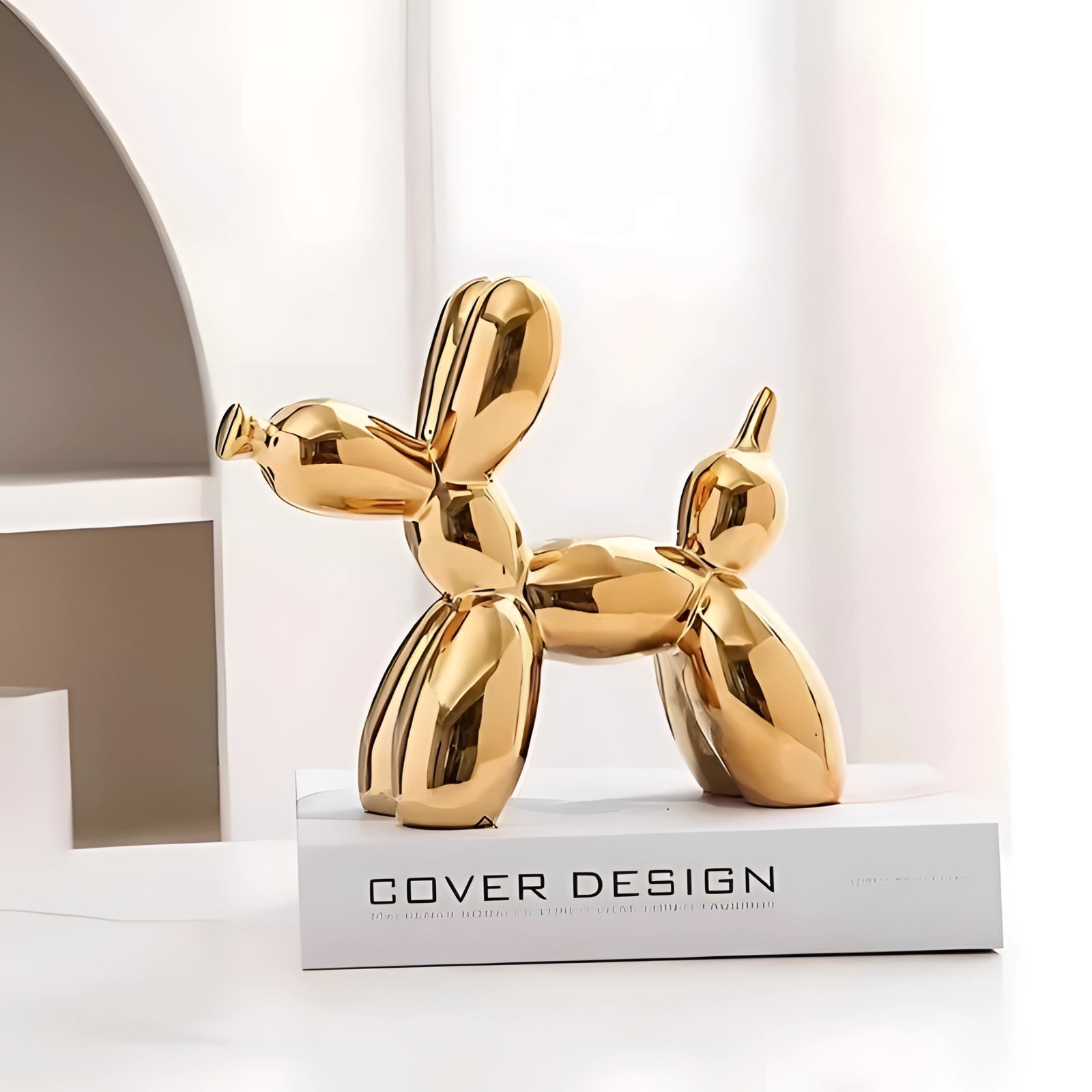 Gold metallic balloon dog sculpture used as modern art decor, showcasing luxurious design and perfect for events or as an elegant accent piece.