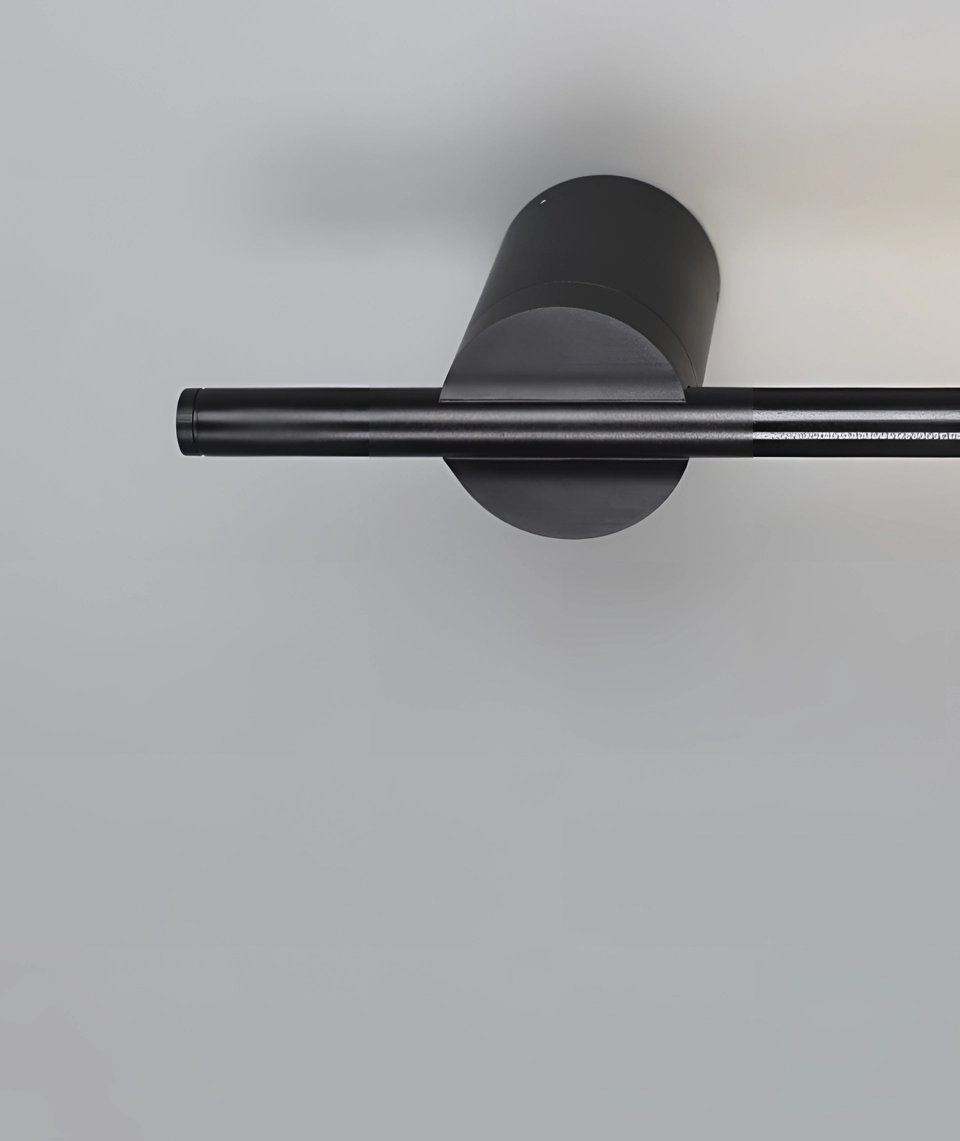 Minimalist LED Wall Sconce with a sleek vertical design, mounted on a wall, emitting a soft, modern light suitable for contemporary home interiors.