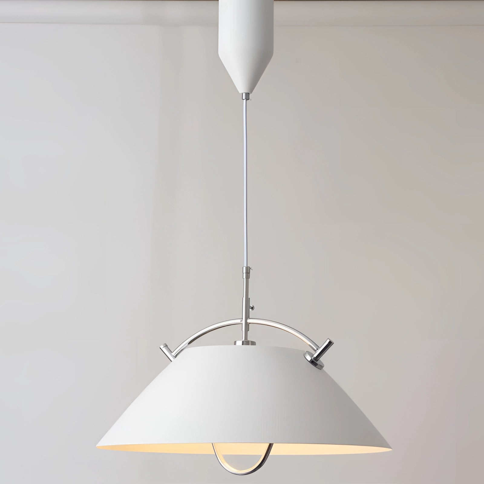 Minimalist Scandinavian white pendant light with a modern adjustable design, featuring a circular shape and hanging from the ceiling as a stylish and functional lighting fixture.