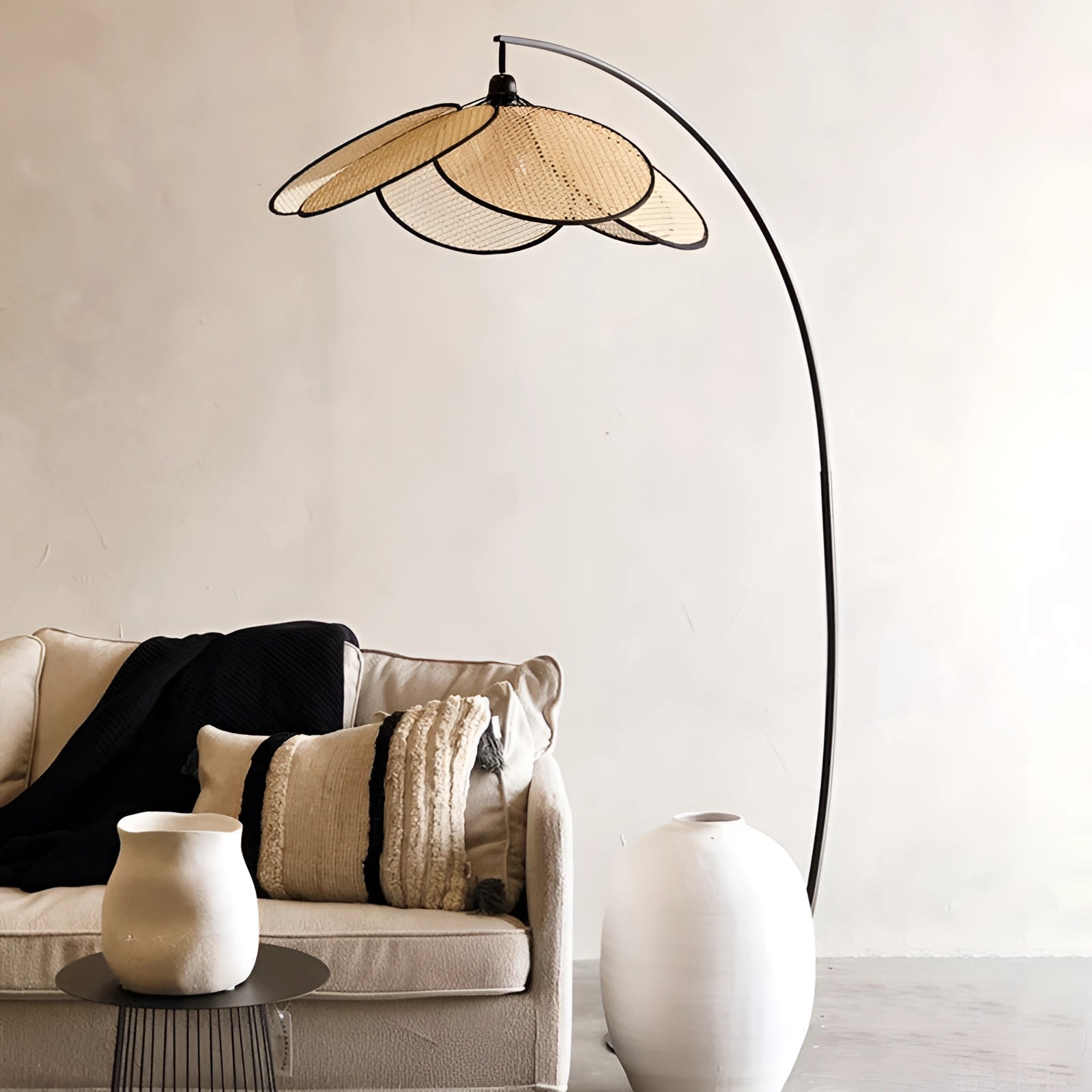 Modern adjustable arched floor lamp with a minimalist design, featuring a sleek white shade and wooden elements, illuminating a stylish living room with a comfortable couch and contemporary interior design.