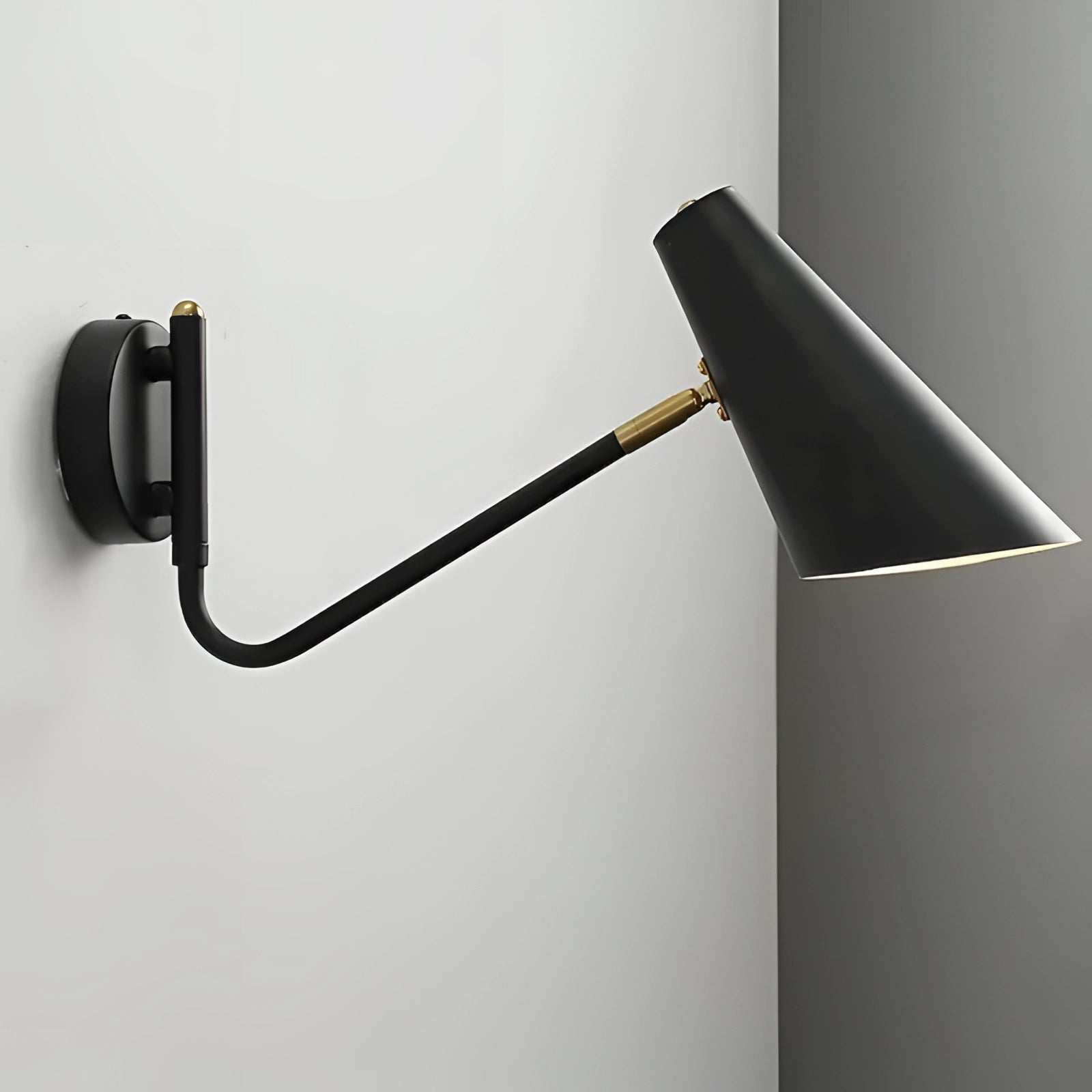 Modern black adjustable wall sconce in a minimalist industrial design featuring a rectangular shape with metal and aluminum components.