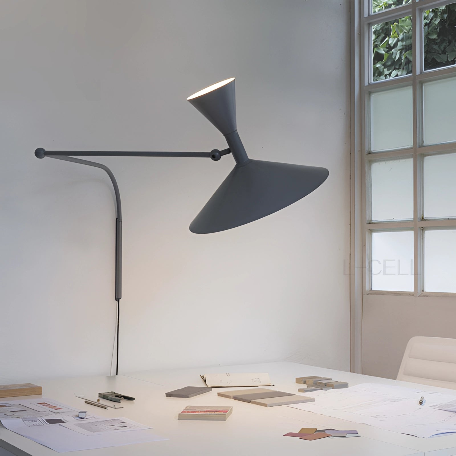 Modern black geometric wall sconce with a contemporary minimalist design, featuring a sleek black finish and angular shapes, mounted on a textured wall in a stylish room setting.