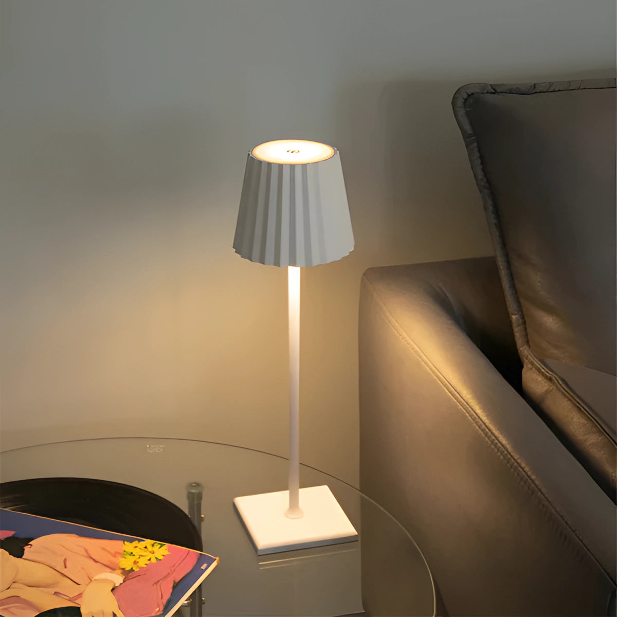 A modern white minimalist table lamp with a slim profile, featuring an elegant light and simple design, paired with a wooden base and a smooth lampshade, suitable for contemporary interior decor on a tabletop.