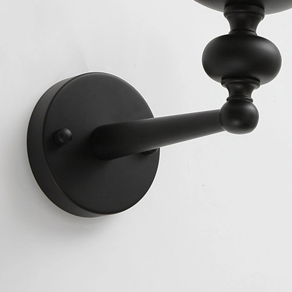 Modern black six-light candle chandelier with elegant symmetrical design, featuring metal finish and circular arrangement, suitable for dining areas.