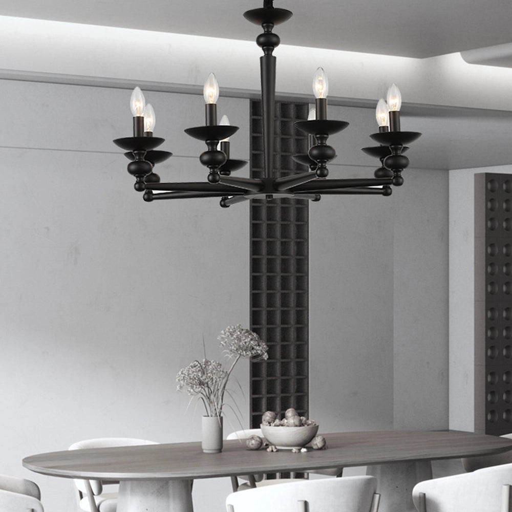 Modern black eight-light candle chandelier with elegant design, hanging over a dining table in a sophisticated interior setting with neutral tones and wooden elements.