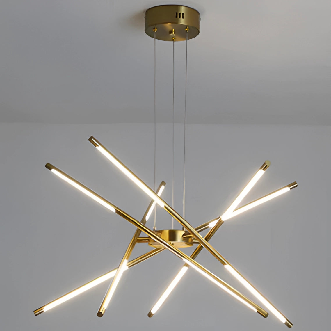 Modern brass LED chandelier with circular design, elegantly hanging from the ceiling, showcasing symmetry and luxurious metal craftsmanship, ideal for dining room decoration.