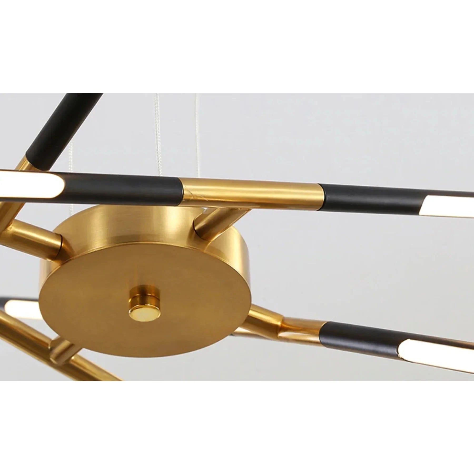 Modern brass LED chandelier with a circular design, featuring luxury decorative elements, metal construction, and elegant finish, suspended from the ceiling ideal for dining rooms.