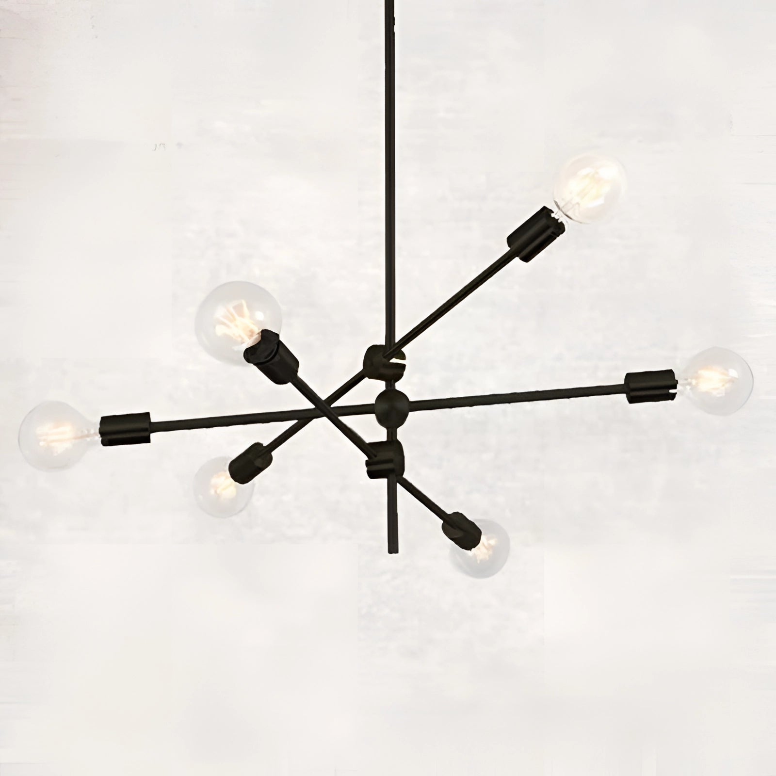 Modern Brass Sputnik Chandelier with 6 Bulbs in Black finish, featuring an adjustable mid-century geometric design, mounted on ceiling.