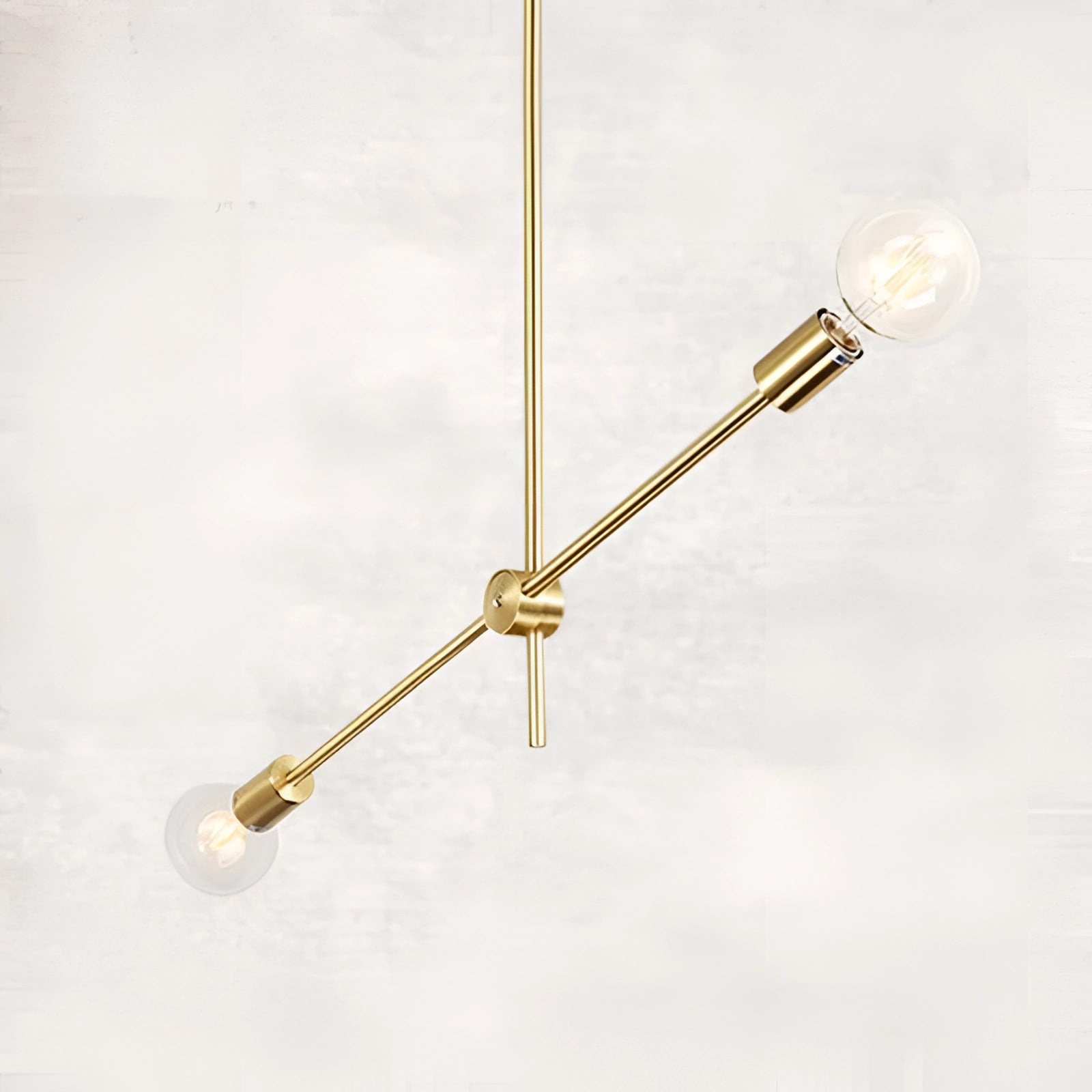 Modern brass Sputnik chandelier with a mid-century geometric design, featuring 2 adjustable bulbs in a gold finish, hanging from the ceiling.