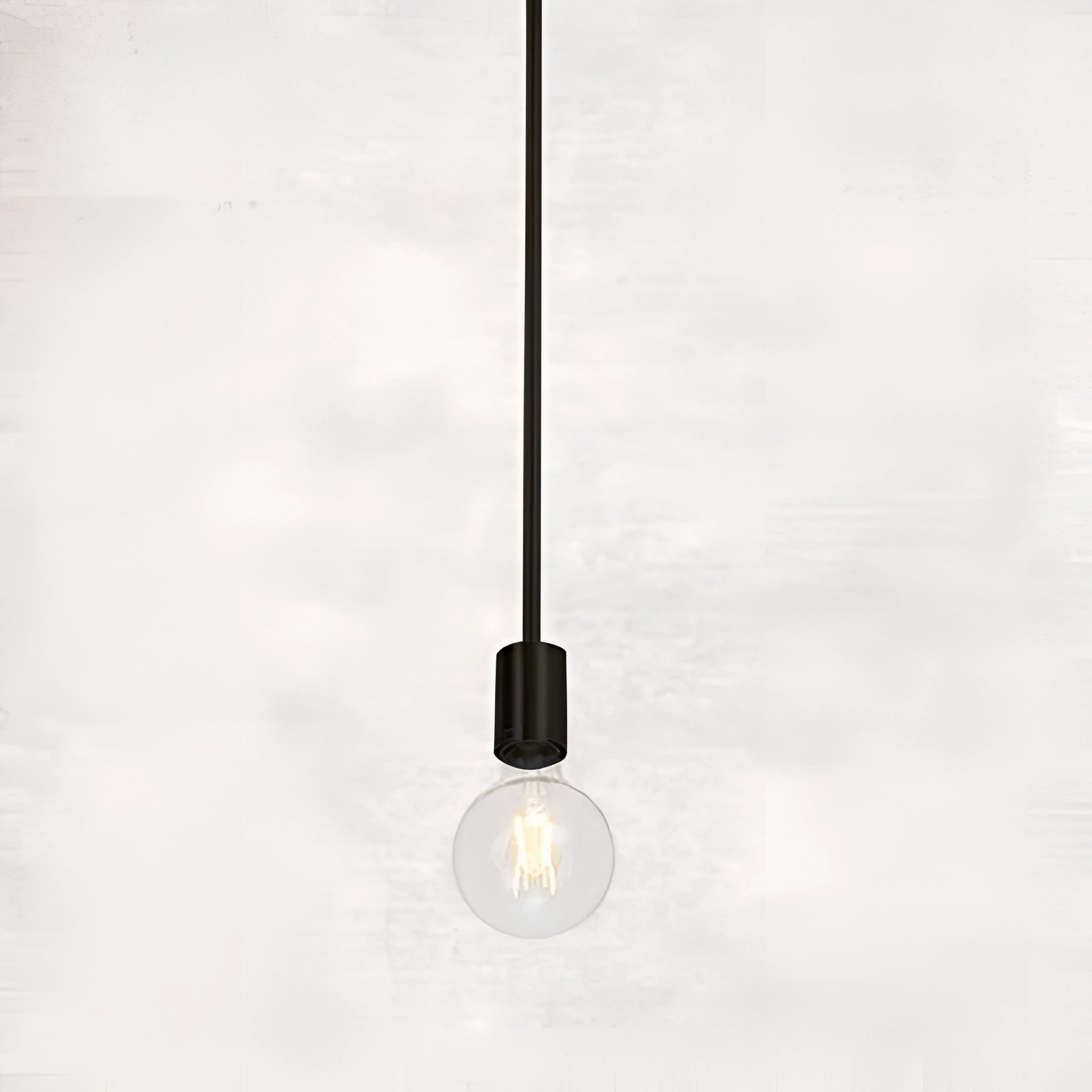 Modern brass Sputnik chandelier with a single bulb in black, featuring an adjustable mid-century geometric design, mounted on a ceiling.