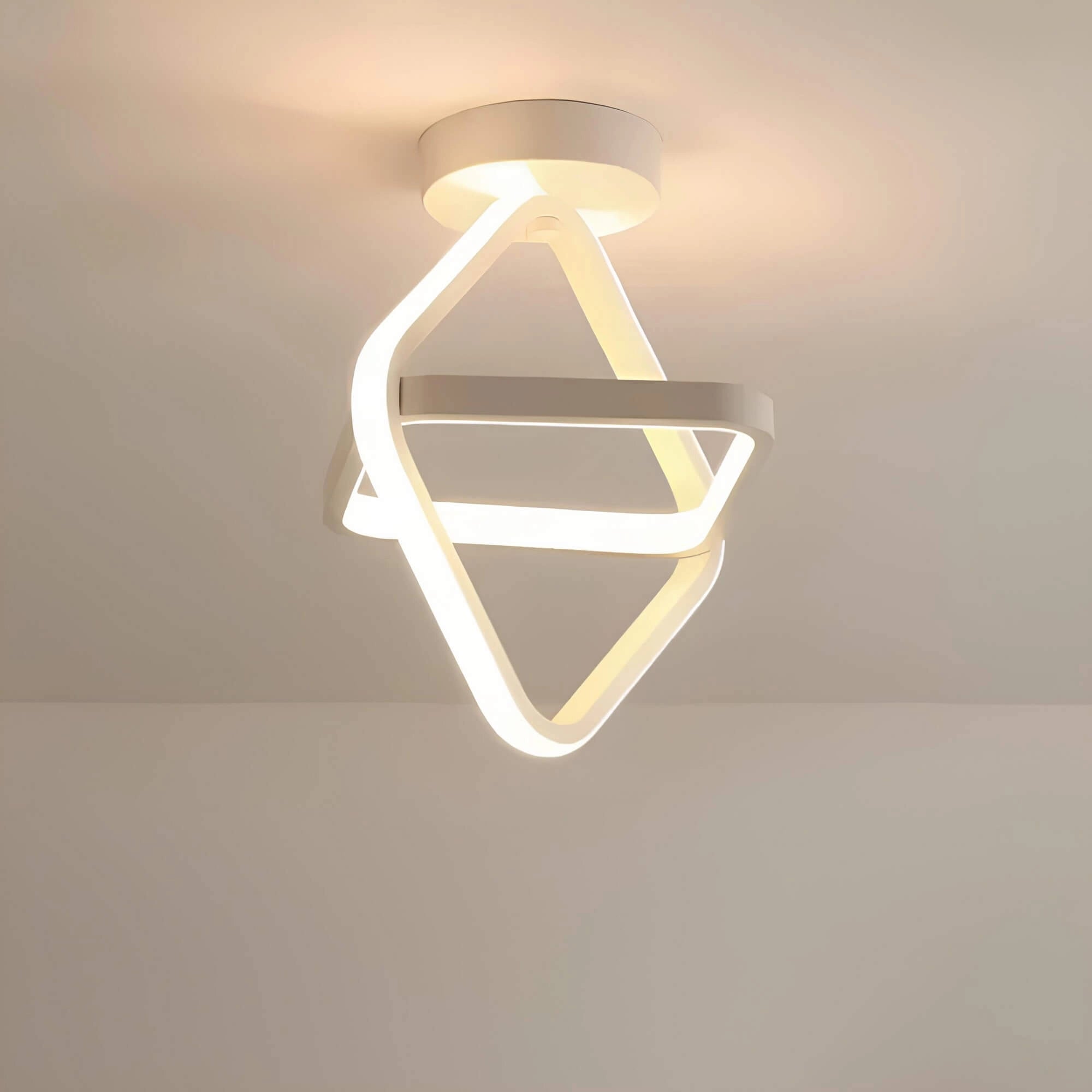 Modern circular LED ceiling light with a minimalist design, featuring a rectangular white frame, mounted on a wooden ceiling with metal fixtures.
