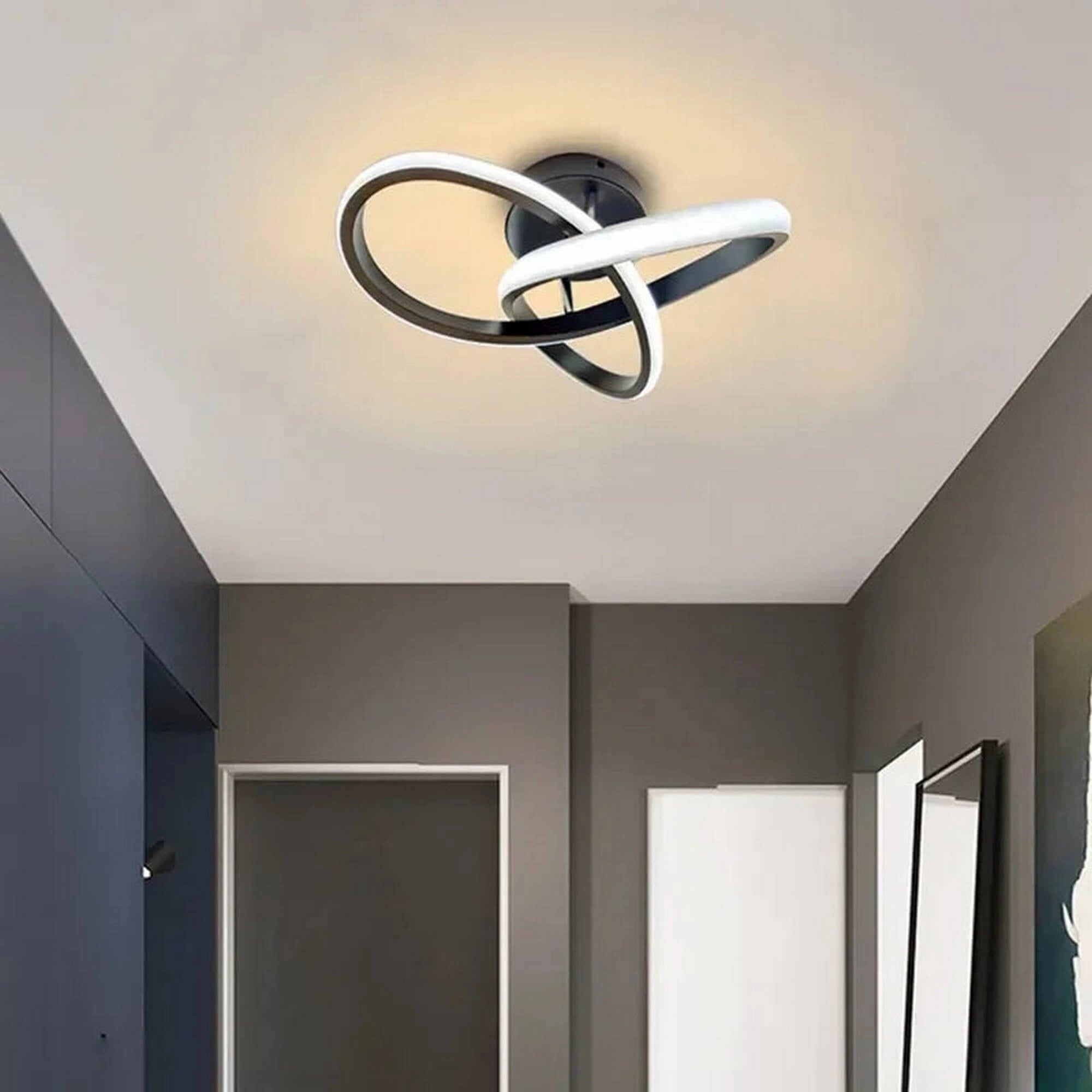 Modern circular LED ceiling light with a minimalist design featuring a wooden and metal fixture. The light is installed on a plaster ceiling, showcasing its energy-efficient properties.