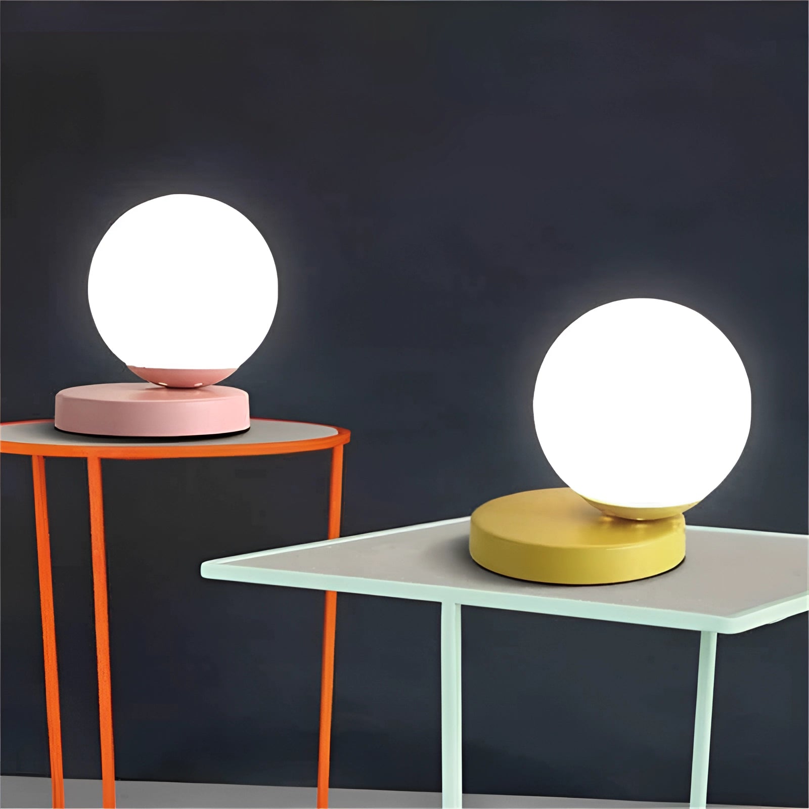 Modern designer orb lamp featuring a LED globe with a metallic base placed on a wooden table, showcasing contemporary interior design with artistic elements and sleek lines.