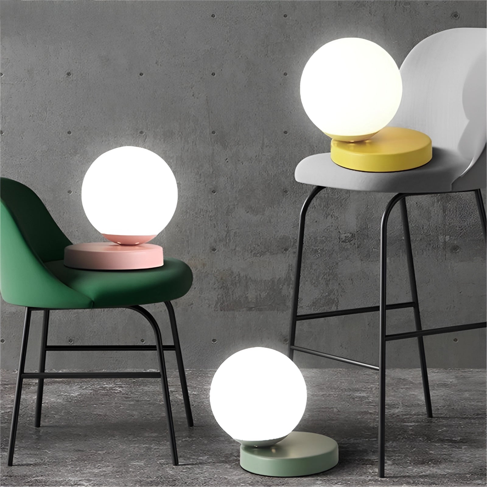 Modern designer orb lamp with a sleek metallic base featuring a glowing LED globe, placed on a wooden table beside a contemporary white chair on wooden flooring.